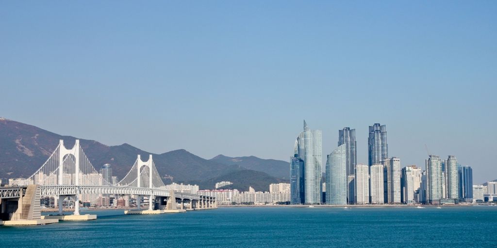 Busan skyline with beach and mountains