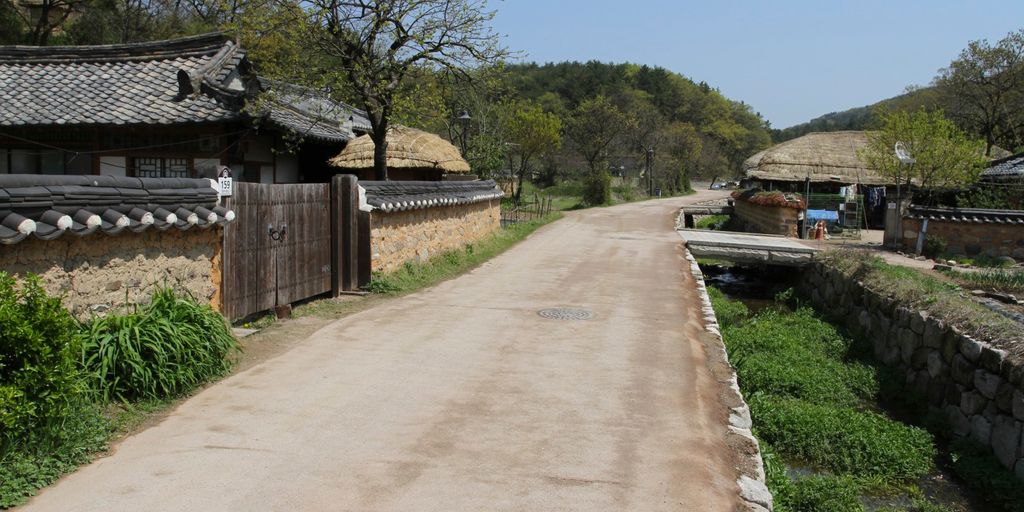 traditional Korean village with hanbok-clad people